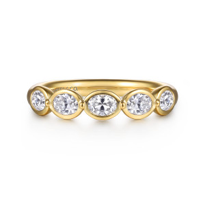 Gabriel & Co. AN16653Y44JJ 14 karat yellow gold Contemporary anniversary band, front view of five rimmed stones joined by tiny beads along the top of the band