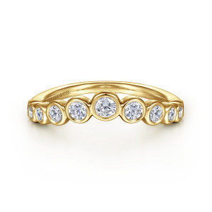 Gabriel & Co. AN16731Y44JJ 14 karat yellow gold Contemporary anniversary band, front view of the arched top edge with the largest round stone at the peak