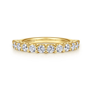 Gabriel & Co. AN16748Y44JJ 14 karat yellow gold Contemporary wedding band, front view of a level row of round stones with plain edges and small prong tips