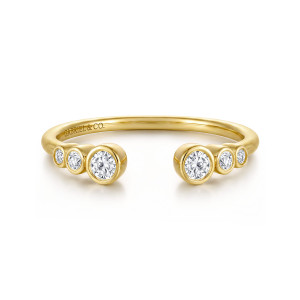 Gabriel & Co. AN16792Y44JJ 14 karat yellow gold Contemporary anniversary band, front view of the open gap with graduated round stones in bezels on both ends