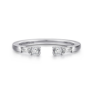 Gabriel & Co. AN16811W44JJ 14 karat white gold Contemporary anniversary band, front view of the gap between two prong-set round stones, each backed by a tapered baguette