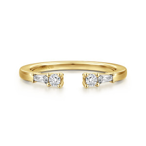Gabriel & Co. AN16811Y44JJ 14 karat yellow gold Contemporary anniversary band, front view of the open gap with a round diamond and tapered baguette at each end
