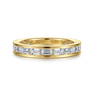 Gabriel & Co. AN16885-6Y43JJ 14 karat yellow gold Art Deco eternity band, front view of sideways baguette stones end to end between two flat walls and a maker's mark inside