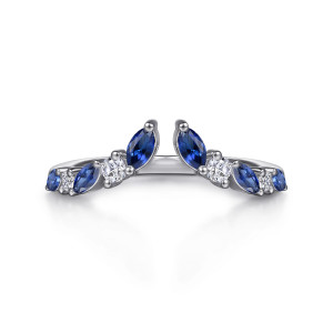 Gabriel & Co. AN17082W44SA 14 karat white gold Contemporary anniversary band, front view of the V shaped chevron with a gap between two facing blue marquise stones