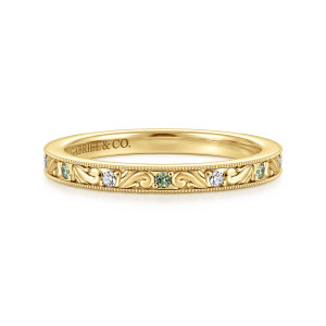 Gabriel & Co. AN17143Y44GS 14 karat yellow gold Victorian anniversary band, front view of raised scrolls with colorless and green stones alternating between beaded milgrain borders