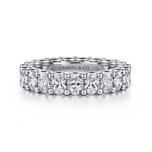Gabriel & Co. AN17148-6W44JJ 14 karat white gold Contemporary eternity band, front view of elongated stones set crosswise, with ball tipped prongs at each joint