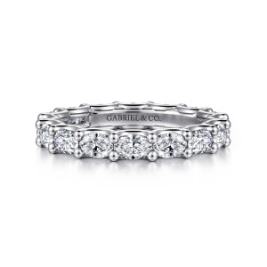Gabriel & Co. AN17149-6W44JJ 14 karat white gold Contemporary eternity band, front view of elongated diamonds lying sideways between pairs of bead tipped prongs