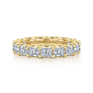 Gabriel & Co. AN17150-6Y43JJ 14 karat yellow gold Contemporary eternity band, front view of elongated stones with trimmed corners in ball tipped prongs