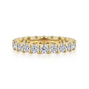 Gabriel & Co. AN17154-6Y44JJ 14 karat yellow gold Contemporary eternity band, front view of round diamonds in a single row with a maker's mark inside