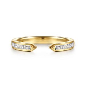 Gabriel & Co. AN17208Y43JJ 14 karat yellow gold Contemporary anniversary band, front view of the open gap between two pointed, baguette set ends