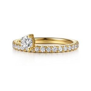 Gabriel & Co. AN17221Y44JJ 14 karat yellow gold Contemporary ring enhancer, front view of a raised round stone beside a line of small round stones