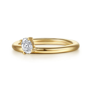 Gabriel & Co. AN17223Y44JJ 14 karat yellow gold Contemporary ring enhancer, front view of the plain rounded hoop with one small elongated stone held up on prongs