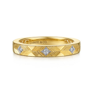 Gabriel & Co. AN17228Y44JJ 14 karat yellow gold Victorian anniversary band, front view of herringbone grooves around kite shaped recesses holding single small diamonds