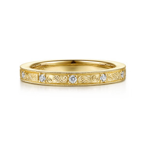 Gabriel & Co. AN17229Y44JJ 14 karat yellow gold Victorian anniversary band, front view of engraved scroll panels alternating with round stones in four prong settings