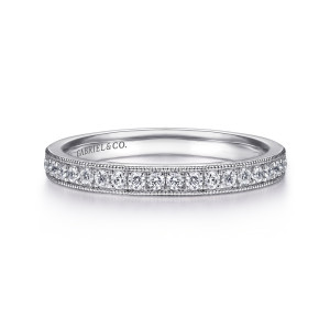 Gabriel & Co. AN7643PT4JJ platinum Victorian wedding band, front view of a straight band with a line of round stones between beaded edges