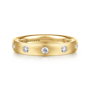 Gabriel & Co. AN7867Y44JJ 14 karat yellow gold Contemporary anniversary band, front view of round diamonds spaced apart across a fine brushed surface