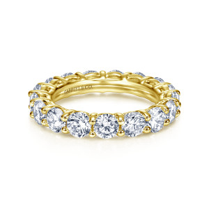 Gabriel & Co. AN7965-4Y44JJ 14 karat yellow gold Classic eternity band, front view of large round stones held between slender prongs along the visible half of the hoop