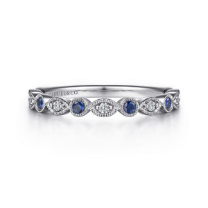 Gabriel & Co. AN8386W44SA 14 karat white gold Victorian anniversary band, front view of blue stones in beaded round frames beside diamonds in pointed oval frames