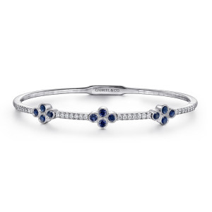 Gabriel & Co. BG3969-57W45SA 14 karat white gold Lusso bangle, front view of three clover shaped blue stone clusters linked by rows of small diamonds