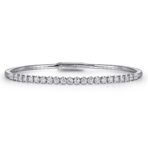 Gabriel & Co. BG3975-57W45JJ 14 karat white gold Lusso bangle, front view of the row of prong set diamonds above the flat clasp plate with a maker's mark