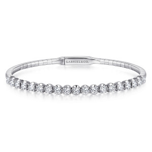 Gabriel & Co. BG3976-57W45JJ 14 karat white gold Lusso bangle, front view of the row of round diamonds above a segmented plain band and a flat maker plate