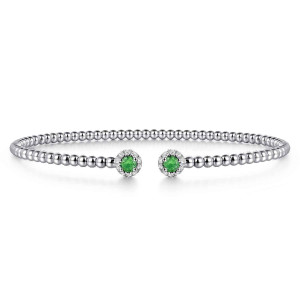 Gabriel & Co. BG4122-62W45EA 14 karat white gold Bujukan bangle, front view of the two green stones with diamond rings facing across the gap