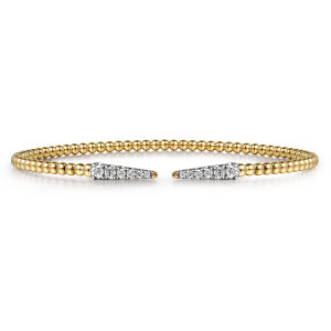 Gabriel & Co. BG4216-62Y45JJ 14 karat yellow gold Bujukan bangle, front view of two tapered diamond tips facing each other across the open gap