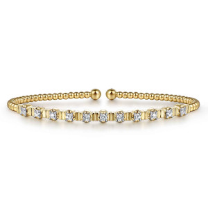 Gabriel & Co. BG4228-57Y45JJ 14 karat yellow gold Bujukan bangle, front view of the full row of prong set diamonds divided by short flat bars