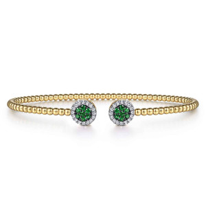 Gabriel & Co. BG4244-57Y45EA 14 karat yellow gold Bujukan bangle, front view of the two round caps, each a green stone cluster inside a diamond ring