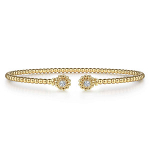 Gabriel & Co. BG4257-57Y45JJ 14 karat yellow gold Bujukan bangle, front view of the single bead strand and the two round caps facing each other