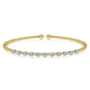Gabriel & Co. BG4279-6M45JJ 14 karat white and yellow gold Bujukan bangle, front view of the diamond row, each stone in a cup with a single bead between