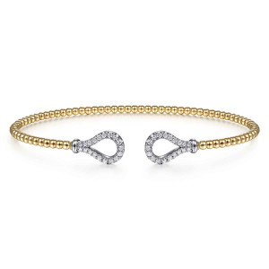 Gabriel & Co. BG4328-57M45JJ 14 karat white and yellow gold Bujukan bangle, front view of the two open teardrop loops edged with small diamonds facing across the gap