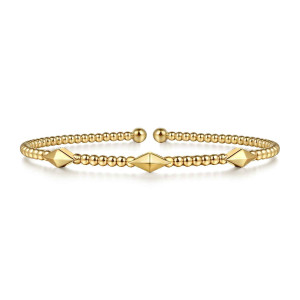 Gabriel & Co. BG4421-57Y4JJJ 14 karat yellow gold Bujukan bangle, front view of the beaded cuff with three faceted pyramid stations and ball ends at the gap