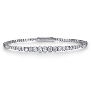 Gabriel & Co. BG4431-57W45JJ 14 karat white gold Lusso bangle, front view of one row of graduated round diamonds with the flat clasp plate behind