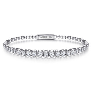 Gabriel & Co. BG4432-57W45JJ 14 karat white gold Lusso bangle, front view of diamonds climbing in size toward the center with the clasp plate at the back
