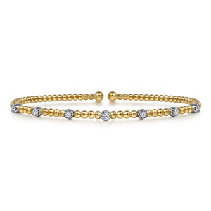 Gabriel & Co. BG4436-6M45JJ 14 karat white and yellow gold Bujukan bangle, front view of the open cuff with diamonds in light cups spaced along a string of polished beads