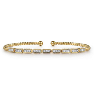 Gabriel & Co. BG4443-57Y45JJ 14 karat yellow gold Bujukan bangle, front view of the rectangular diamond stations linked in a line below the ball tipped gap