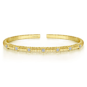 Gabriel & Co. BG4465-62Y45JJ 14 karat yellow gold Contemporary bangle, front view of the ribbed band with a row of milgrain bezel diamonds and flat ends