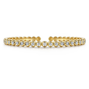 Gabriel & Co. BG4611-57Y45JJ 14 karat yellow gold Contemporary bangle, front view of the unbroken row of bezel set diamonds with a maker's mark on the inner end