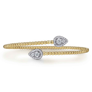 Gabriel & Co. BG4719-57Y45JJ 14 karat yellow gold Bujukan bangle, front view of the bypass ends with a teardrop tip pointing each way