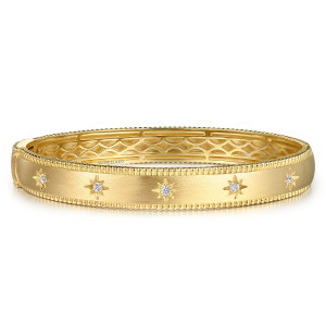 Gabriel & Co. BG4935-65Y45JJ 14 karat yellow gold Bujukan bangle, front view of the satin face with star set diamonds and openwork showing inside