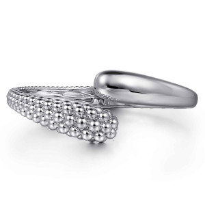 Gabriel & Co. BG4955-57SVJJJ sterling silver Bujukan bangle, front view of the smooth tapered end passing the rounded cluster of metal beads
