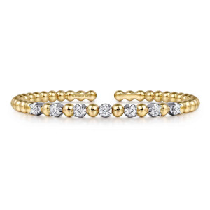 Gabriel & Co. BG4973-57M45JJ 14 karat white and yellow gold Bujukan bangle, front view of the row of round diamonds alternating with polished beads, open gap behind