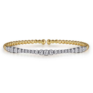 Gabriel & Co. BG5060-57M45JJ 14 karat white and yellow gold Bujukan bangle, front view of the diamond row, larger stones at the middle and near both ends