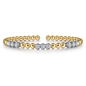 Gabriel & Co. BG5076-62M45JJ 14 karat white and yellow gold Bujukan bangle, front view of three diamond groups spaced between runs of large plain beads