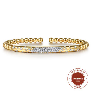 Gabriel & Co. BG5085-57Y45JJ 14 karat yellow gold Bujukan bangle, front view of the smooth curved bar with a diamond cluster and scattered flush-set diamonds