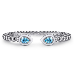 Gabriel & Co. BG5098E9SVJBT sterling silver Bujukan bangle, front view of the two blue pear-shaped stones in white enamel frames meeting at the gap