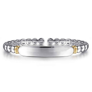 Gabriel & Co. BG5105-57MZJJJ sterling silver and 14 karat yellow gold Bujukan bangle, front view of the smooth bar plate flanked by small warm-toned collars above the open gap