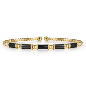 Gabriel & Co. BG5136E857Y4JJJ 14 karat yellow gold Bujukan bangle, front view of the open cuff with black enamel panels alternating with larger metal balls