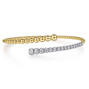 Gabriel & Co. BG5184-57M45JJ 14 karat white and yellow gold Bujukan bangle, front view of the overlapping ends, growing beads on top and graduated round diamonds below